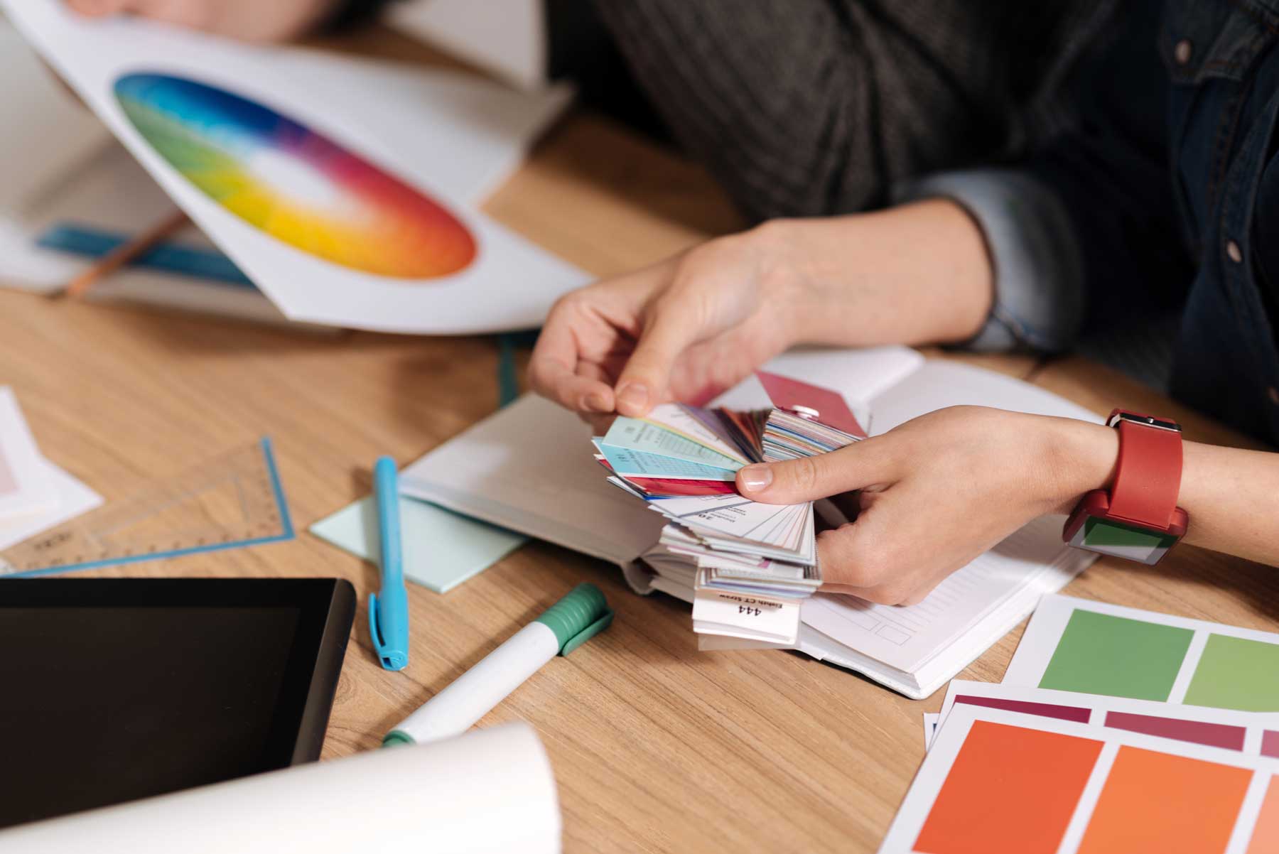 Pieces of paper being held by a nice professional designer